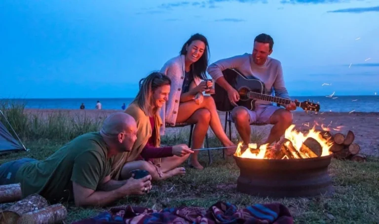 Friends enjoy a beach bonfire at Cedar Dunes Provincial Park in Western Prince Edward Island.