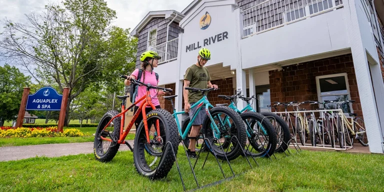 Guests prepare for a cycling adventure outside Mill River Resort in Western Prince Edward Island.